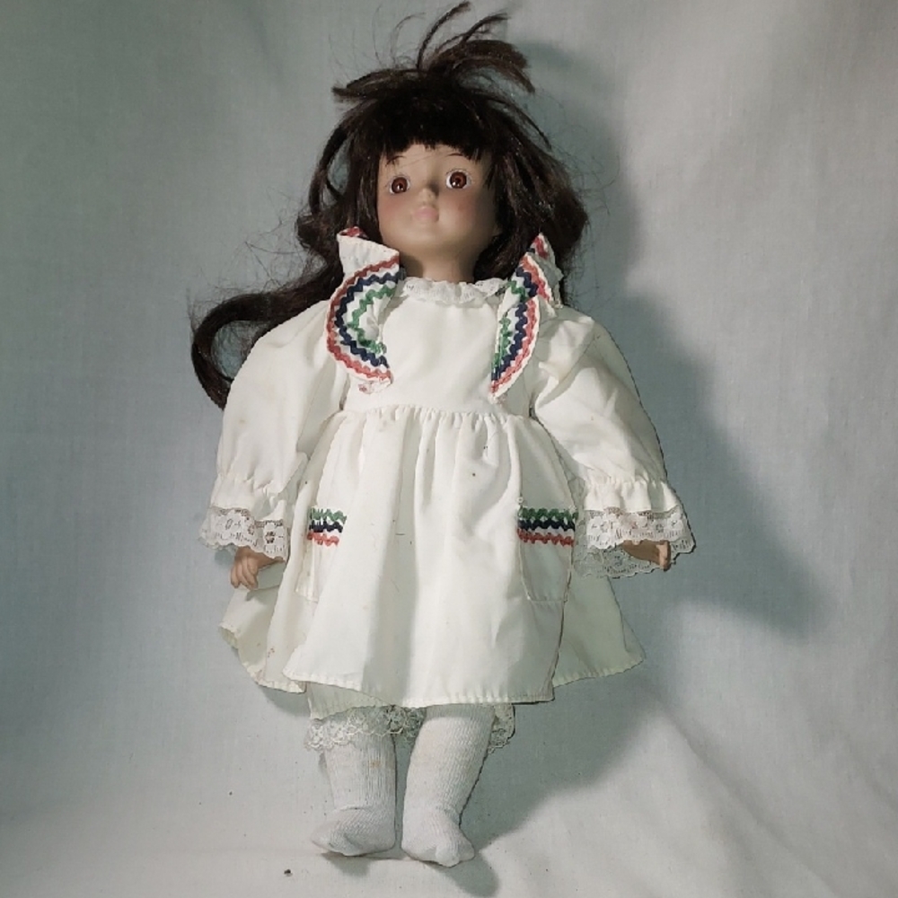 Vintage 1990 Heritage Mint Porcelain Doll with White Dress and Colorful Trim